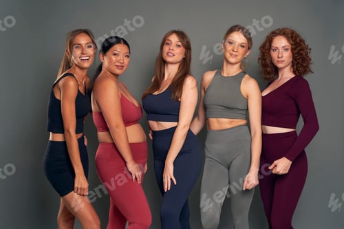Preview: Portrait of five young women in sports clothes in studio shot