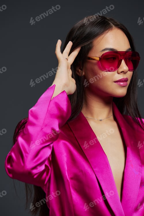 Preview: pretty woman in a pink mini dress fashion glasses luxury isolated background