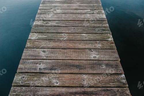 Preview: Part of the old wooden bridge across the lake. The background texture. road across the river. brown