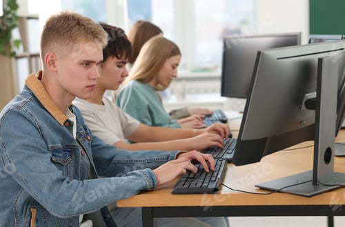 Preview: Students taking online exam indoors, selective focus