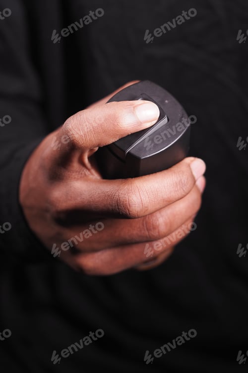 Preview: hand holding a body spray closeup
