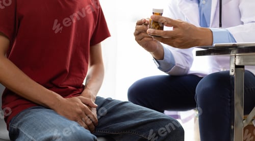 Preview: Doctor giving advice on medicines for patients with male health problems.