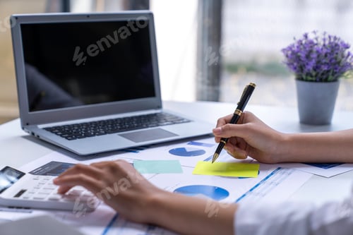 Preview: financial business woman calculating corporate income tax data and analyze financial stock charts th