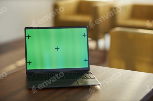 Preview: Displaying Laptop with Green Screen in Office Setting