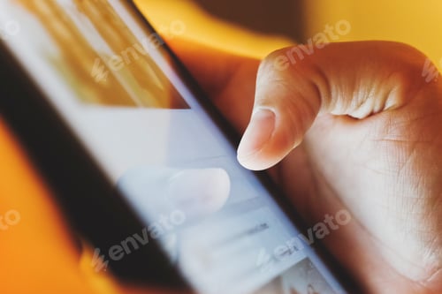 Preview: image of hand using digital tablet close up