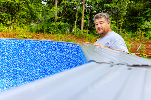 Preview: In backyard of house, we are assembling a construction ground swimming pool