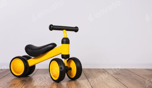 Preview: Children's tricycle for the little ones in the children's room. Children's leisure time. Copy space.