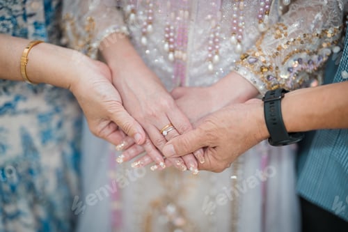 Preview: Parents holding bride hands during a wedding ceremony