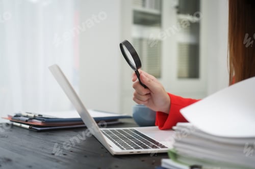 Preview: A cheerful businesswoman works her office desk as a legal consultant,handling online civil cases