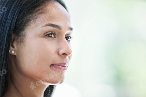 Preview: Mixed race caucasian woman in a business center lobby.