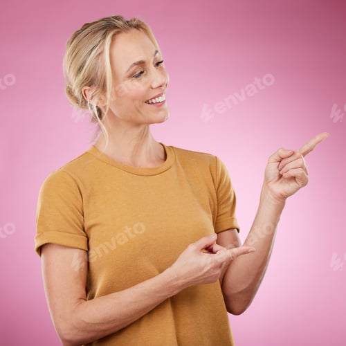 Preview: Happy, pointing and female model in studio to mockup for advertisement or product placement. Happin
