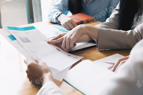 Preview: Asian business adviser meeting to analyze and discuss the situation on the financial report in the