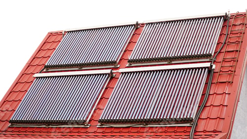 Preview: Solar glass tube hot water panel array mounted on a tiled roof. water heating batteries.