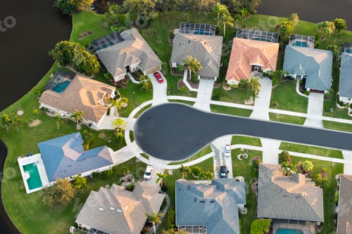 Preview: Aerial evening view of spacious family houses in Florida suburban area.