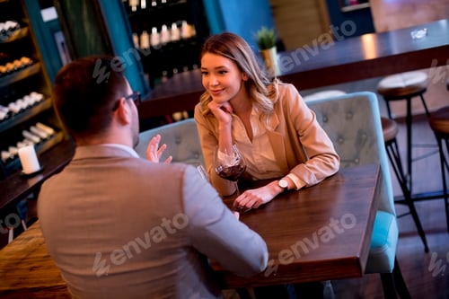 Preview: Young couple enjoying lunch in the restaurant