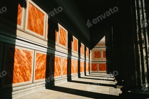 Preview: many marble columns on the floor, with windows, against dark wall