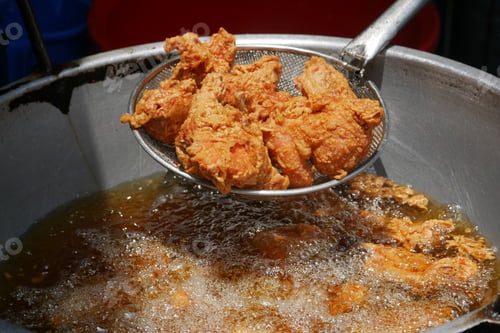 Preview: Fried chicken in deep fry outdoor