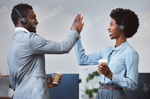Preview: Two happy african american call centre telemarketing agents giving each other a high five and cheer