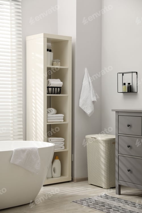 Preview: Stylish bathroom interior with grey chest of drawers and shelving unit