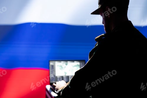 Preview: Hacker at Computer with National Flag Background