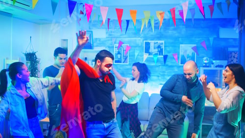 Preview: Cheerful young man wearing a superhero red cape