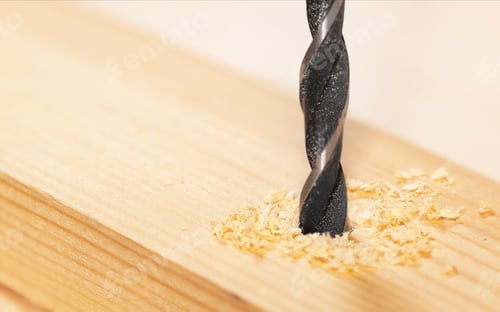 Preview: Metal drill bit make holes in a wooden plank
