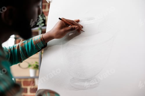 Preview: Student guy drawing on canvas