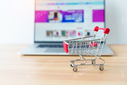 Preview: Shopping cart and laptop computer with marketplace website.