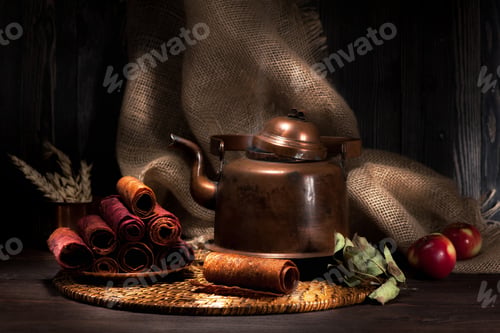 Preview: still life sweet dried apples and vintage copper kettle with tea. rustic style