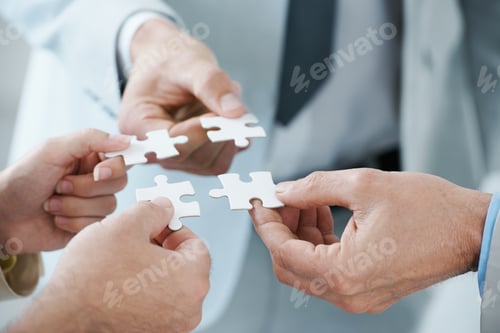 Preview: A business concept image of puzzle pieces fitting together - closeup