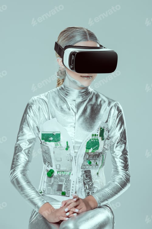 Preview: silver robot using virtual reality headset isolated on grey, future technology concept