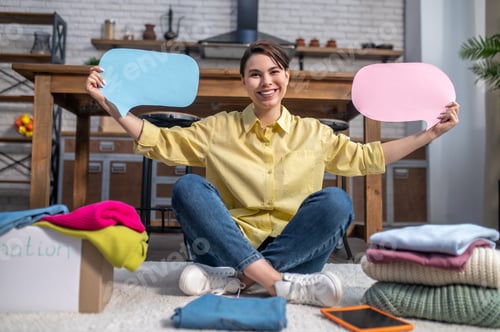 Preview: Active female volunteer calling for clothing donations