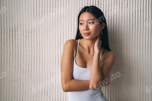 Preview: Portrait of shy and beautiful korean woman, posing as asian model, looking away