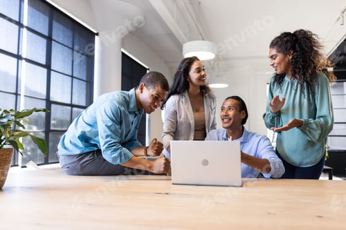 Preview: Collaborating in modern office, diverse business team sharing ideas around laptop