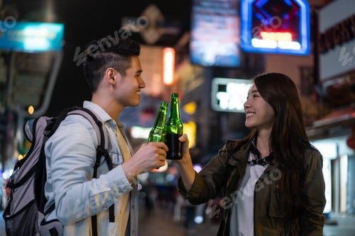 Preview: Asian attractive couple drinking alcohol and having party together.