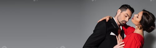 Preview: Sexy woman with burgundy lips hugging elegant man on grey background, banner