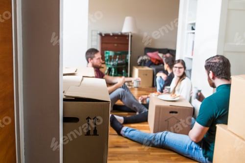 Preview: Group of friends eating sandwiches while moving house