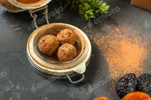 Preview: Candy Dressing Cocoa (Dried Fruit Filling) Sweets On A Dark Background. Top View. Copy Space