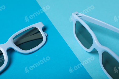 Preview: Blue glasses with dark lenses on blue background
