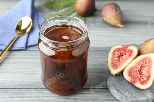 Preview: Jar of tasty sweet jam and fresh figs on grey table