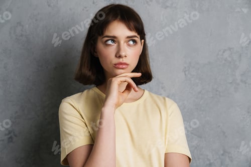 Preview: Attractive pensive thoughtful young woman