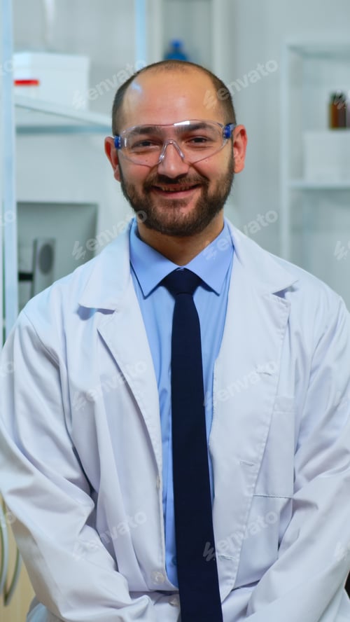 Preview: Experienced man scientist looking at camera smiling
