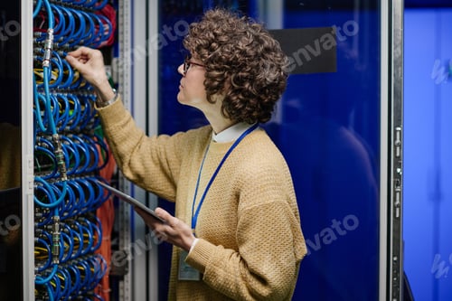 Preview: System administrator working in big data center