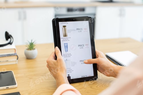 Preview: Caucasian woman purchasing cosmetics online using tablet in modern home setting