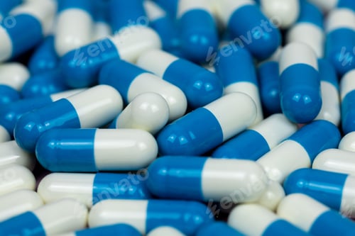 Preview: Close-up shot of scattered blue and white pills