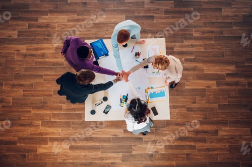 Preview: High angle of a multiracial business people having a meeting in an office