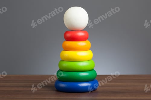 Preview: Baby toy: Stack of wooden colored rings