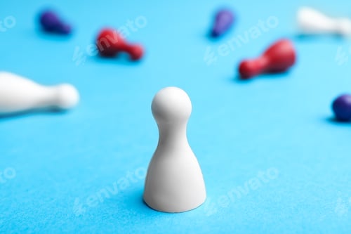 Preview: White pawn standing alone and other fallen down on table. Victory concept