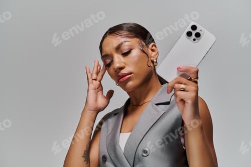 Preview: Stylish young woman showcasing modern fashion in a creative studio setting