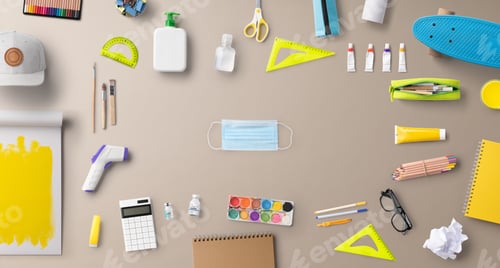 Preview: Flat lay top view of face mask and school supplies, back to school and coronavirus concept